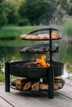 Lade das Bild in den Galerie-Viewer, Multifunktionale Feuerschale „MONTANA X“ 60 cm mit Grillrost 50 cm - Cook King - Shop
